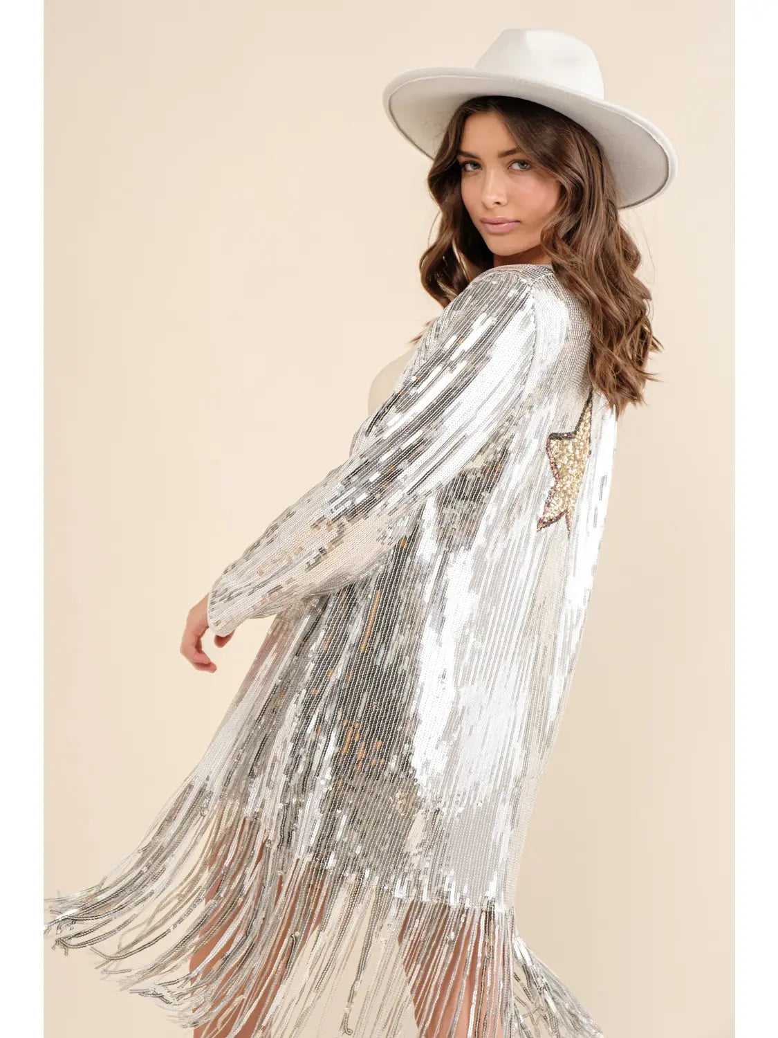 side view of a woman wearing silver Sequin Fringe star on the back Duster with a white hat.